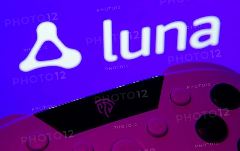 Dhaka, Bangladesh- 14 Nov 2025: A close-up of a gamepad with the Amazon Luna seen on screen in the background