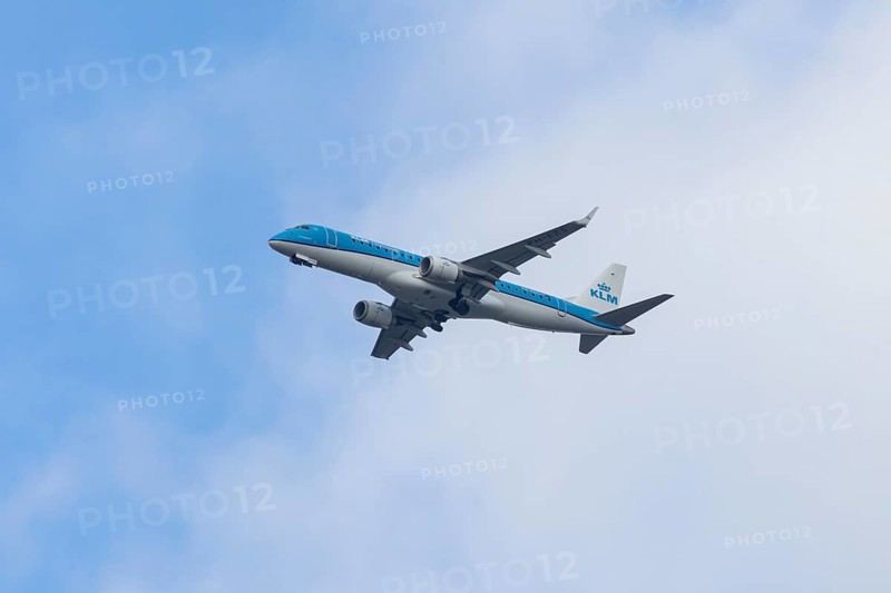 Embraer ERJ-190 jet passenger aircraft of Royal Dutch KLM cityhopper airlines in flight on approach to London city airport, England, United Kingdom