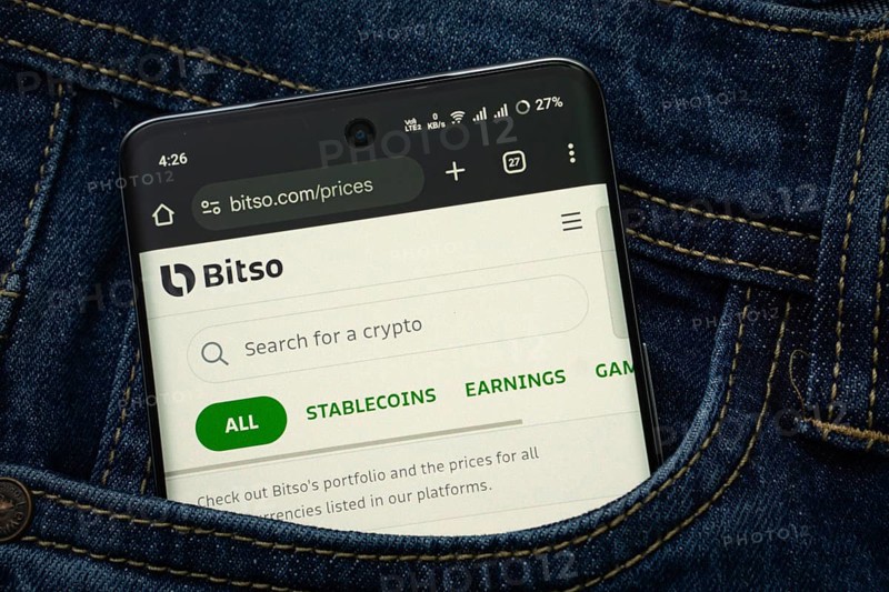 Dhaka, Bangladesh- 15 June 2025: A smartphone displaying the Bitso.com web interface peeks out of a denim pocket