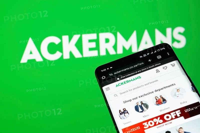 Dhaka, Bangladesh- 03 July 2025: Smartphone displaying Ackermans web interface against Ackermans logo background