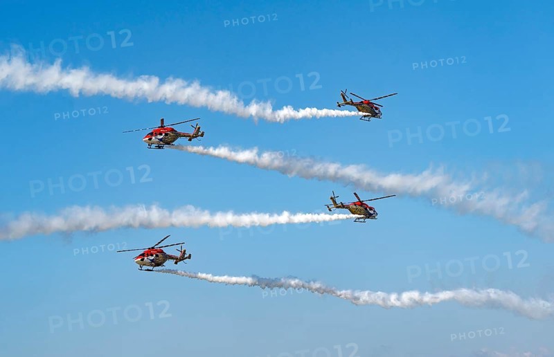 Indian Air Force (IAF) ALH Mk1 Sarang helicopters soar through the sky during an air show as part of the 93rd Air Force Day celebrations on November 8, 2025 in Guwahati, India