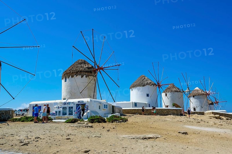 Mykonos, Cyclades, Greece - The six sixteenth-century windmills, lined up on a hill above Mykonos Town, Mykonos Chora, are the island's landmark. Mykonos is part of the Cyclades archipelago in the Aegean Sea