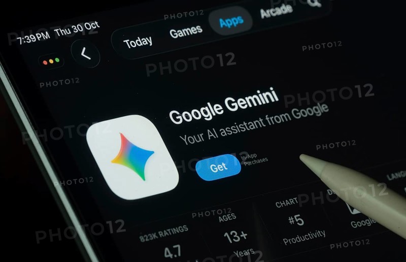 Dhaka, Bangladesh- 30 Oct 2025: Google Gemini app displayed on a iPad screen in dark mode with a digital pen pointing at it