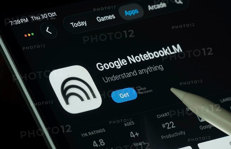 Dhaka, Bangladesh- 30 Oct 2025: Goole NotebookLM app displayed on a iPad screen in dark mode with a digital pen pointing at it