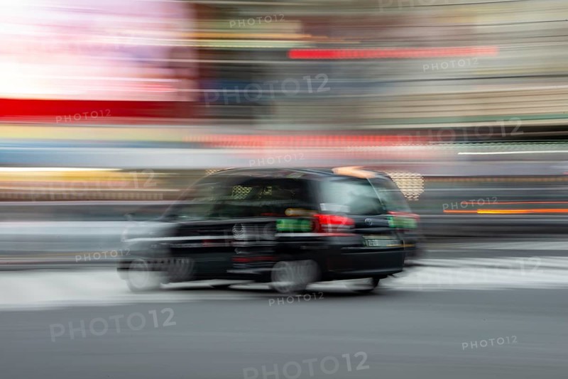 Black taxi driving, motion blur, long exposure, Shubuya Crossing, Shibuya, Tokyo, Japan