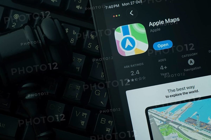 Dhaka, Bangladesh- 28 Oct 2025: An iPad displaying the Apple Maps app against a judge's gavel and dark keyboard background