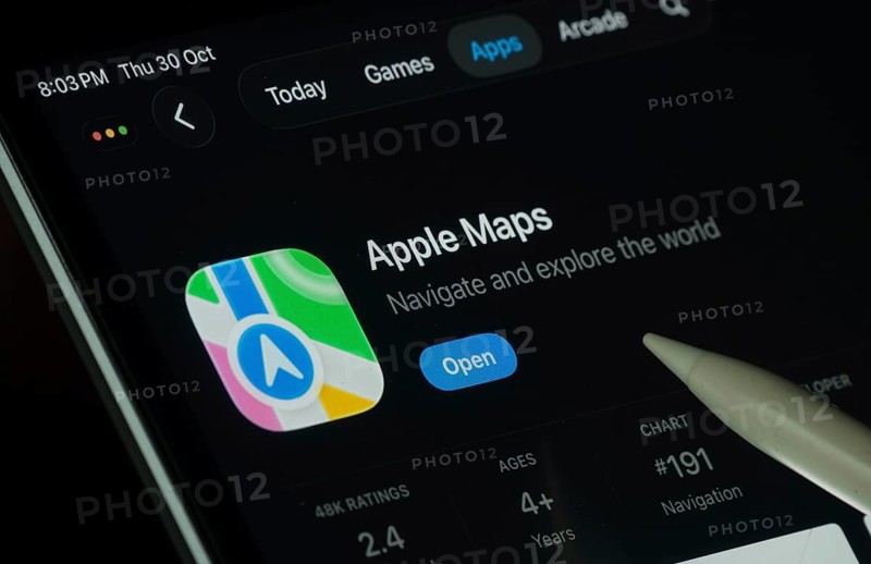 Dhaka, Bangladesh- 30 Oct 2025: Apple Maps app displayed on a iPad screen in dark mode with a digital pen pointing at it