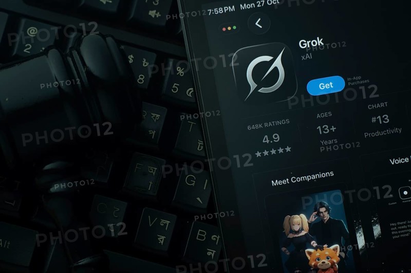 Dhaka, Bangladesh- 28 Oct 2025: An iPad displaying the Grok Ai app against a judge's gavel and dark keyboard background