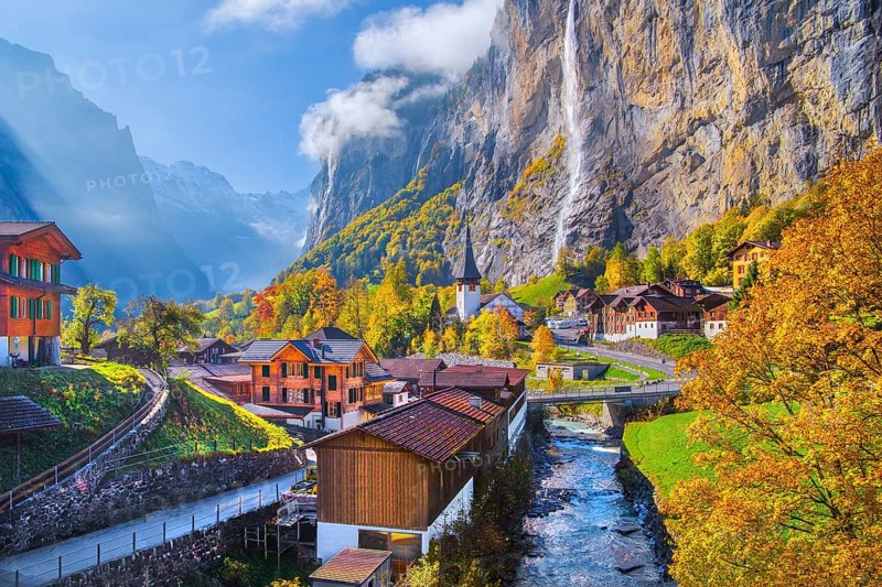 View of town and valley with Staubbach waterfall in autumn, Lauterbrunnen, Bernese Oberland, Canton of Bern, Switzerland