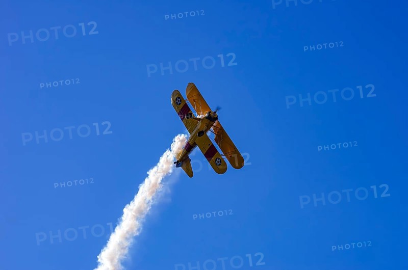 A Boeing PT-17 Stearman biplane, also Boeing Stearman Model 75, with the inscription 399 USNAVY N67193 during a flight demonstration as part of an air show on Rossfeld in Metzingen-Glems, Baden-Württemberg, Germany, for editorial use only