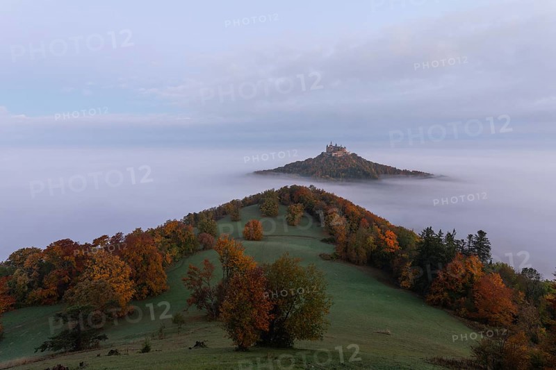 Hohenzollern Castle in a sea of fog at sunrise, autumn in the Swabian Jura