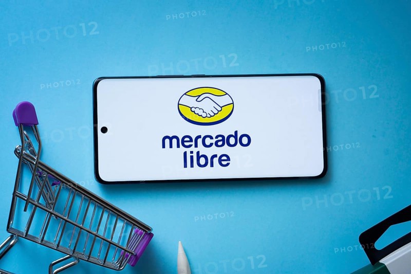 Dhaka, Bangladesh- 03 July 2025: Smartphone displaying Mercado Libre logo with shopping cart on a blue background