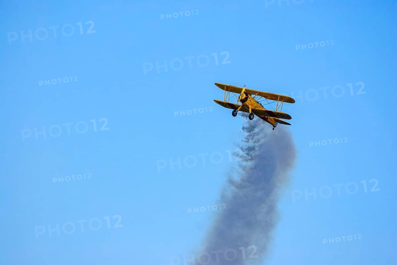 A Boeing-Stearman biplane during a flight demonstration as part of an air show at the Rossfeld in Metzingen-Glems, Baden-Württemberg, Germany, for editorial use only