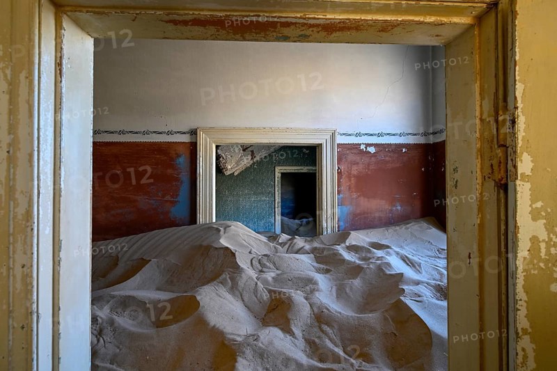 Sand mountains in a former dwelling house, interior photograph, Kolmanskop, restricted diamond area, near Lüderitz, Karas region, Namibia