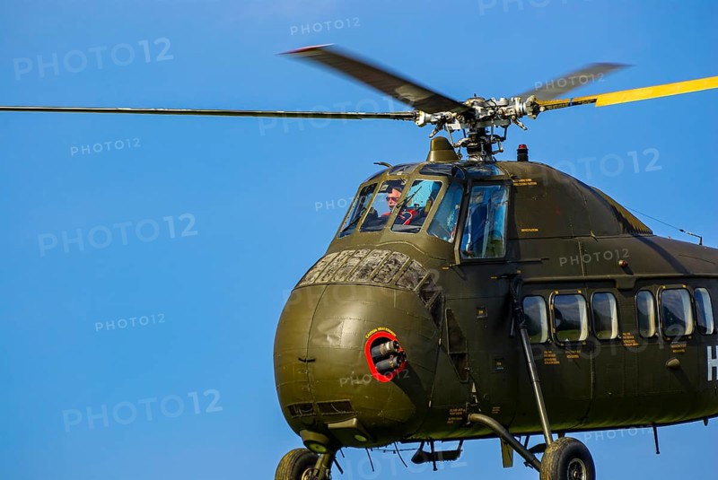 A Sikorsky S-58C transport helicopter in the colours of the German Army with the registration D-HAUG during a flight demonstration as part of an air show at the Rossfeld in Metzingen-Glems, Baden-Württemberg, Germany, for editorial use only