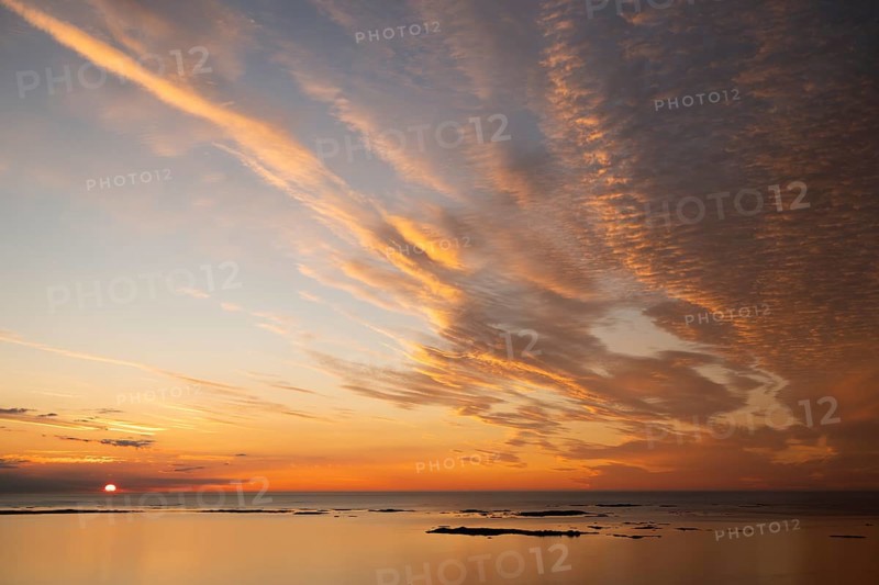 Offshore islands and skerries, sea, dramatically illuminated clouds, sunset, Otroya or Otrøya island, Møre og Romsdal, Norway