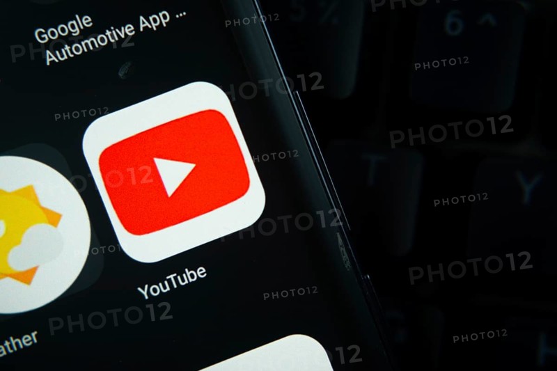 Dhaka, Bangladesh- 27 July 2025: Close-up of smartphone screen showing the youtube app icon with a dark interface