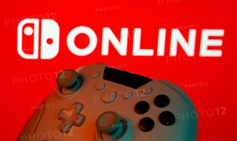 Dhaka, Bangladesh- 15 July 2025: Game controller in front of nintendo online logo on a background