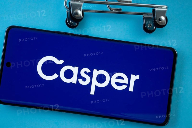 Dhaka, Bangladesh- 03 July 2025: Smartphone screen showing the Casper logo with shopping cart wheels on a blue background