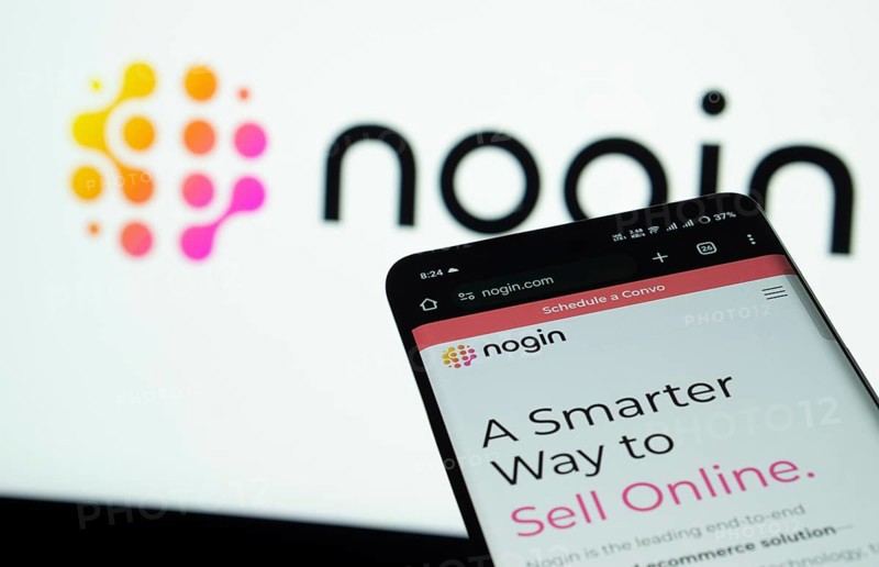 Dhaka, Bangladesh- 03 July 2025: Smartphone displaying nogin web interface against nogin logo background