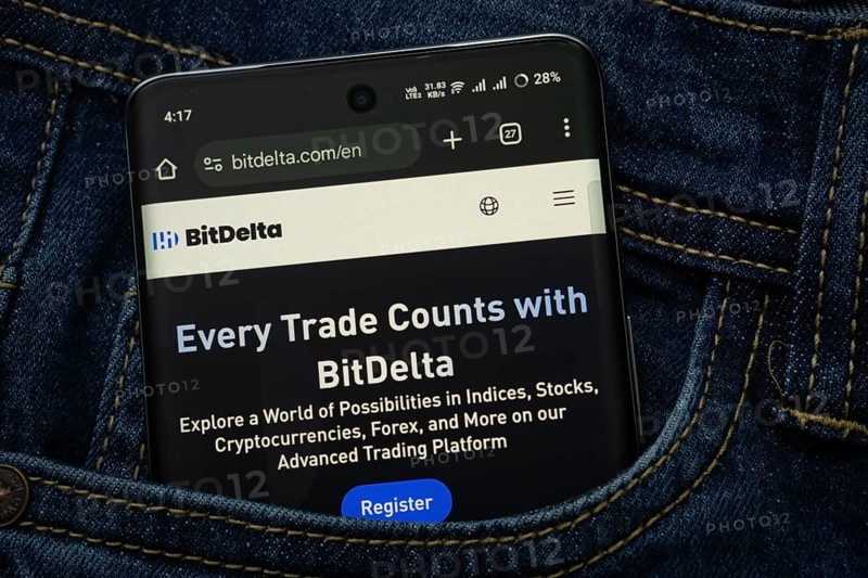 Dhaka, Bangladesh- 15 June 2025: A smartphone displaying the BitDelta.com web interface peeks out of a denim pocket