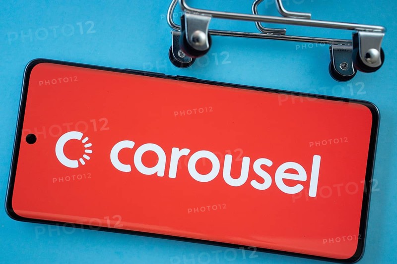 Dhaka, Bangladesh- 03 July 2025: Smartphone screen showing the Carousell logo with shopping cart wheels on a blue background