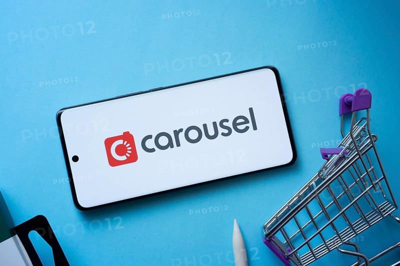 Dhaka, Bangladesh- 03 July 2025: Smartphone displaying Carousell logo with shopping cart on a blue background