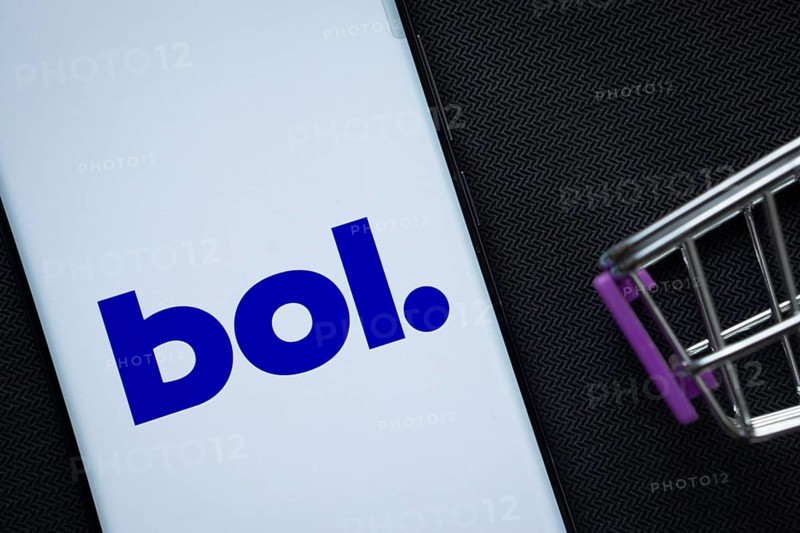 Dhaka, Bangladesh- 03 July 2025: A smartphone displaying the bol logo next to a miniature shopping cart on a background