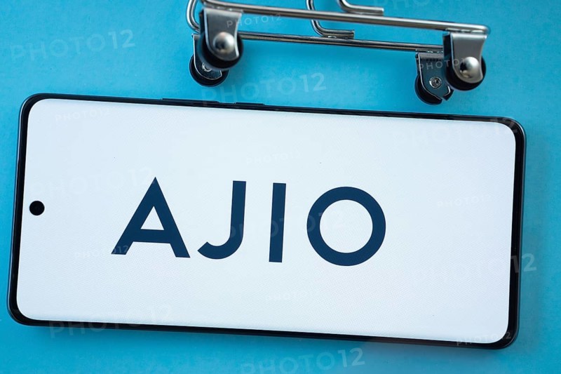 Dhaka, Bangladesh- 03 July 2025: Smartphone screen showing the AJIO logo with shopping cart wheels on a blue background