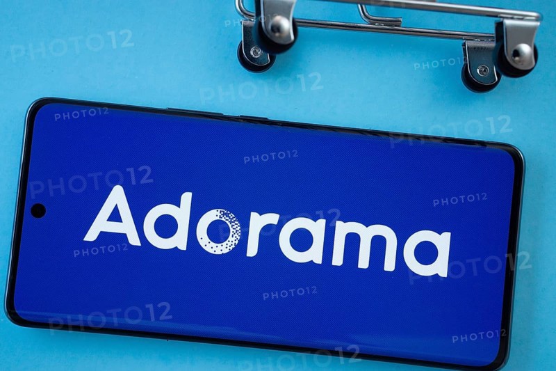 Dhaka, Bangladesh- 03 July 2025: Smartphone screen showing the Adorama logo with shopping cart wheels on a blue background