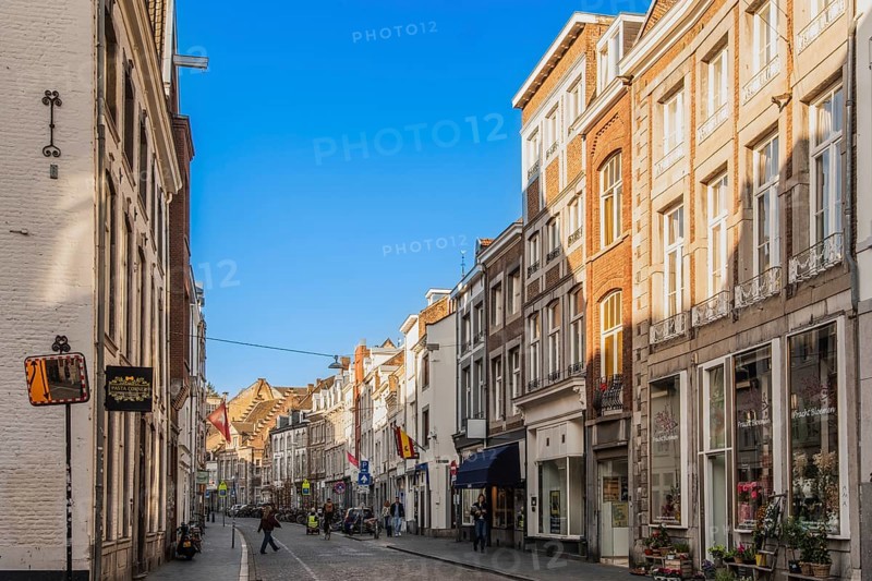 Alley with cafes and shops in the old town of Maastricht, the Netherlands