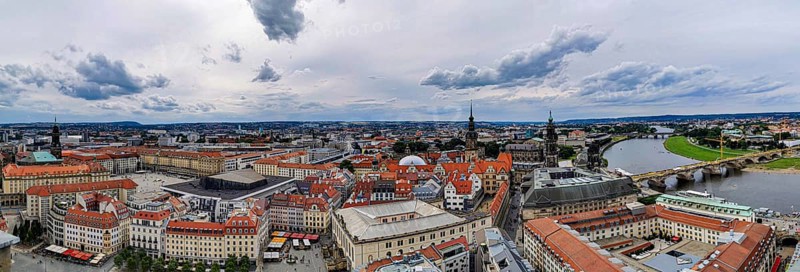 City panorama of Dresden, with river, bridge and distinctive architectures under cloudy sky, Dresden