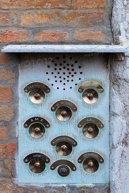 Brass bell buttons on a residential building, Venice, Veneto, Italy