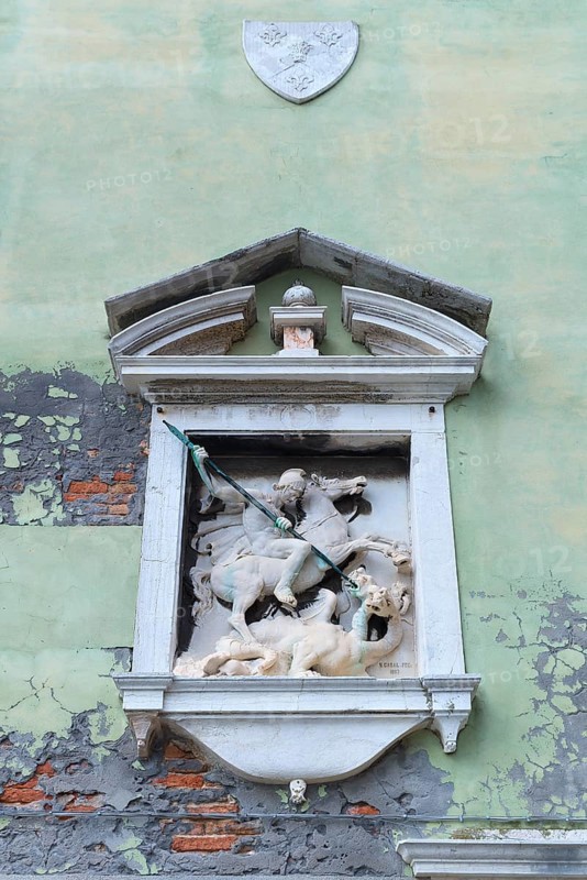 Sculpture of Saint George with the dragon on a house wall, Venice, Veneto, Italy
