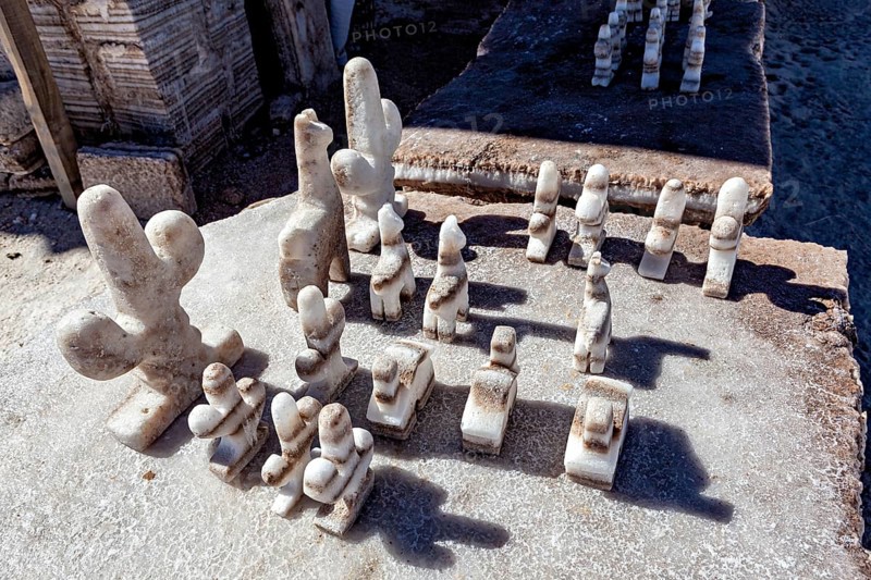 Salt chess pieces on a board in a detailed, bright desert setting, salt sculptures in the Salar de Cauchari salt pan near Salta in Argentina