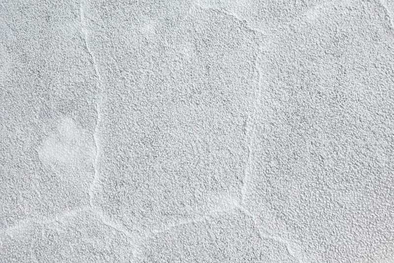 Rough grey plaster surface with visible structure, The Salar de Cauchari salt pan near Salta in Argentina