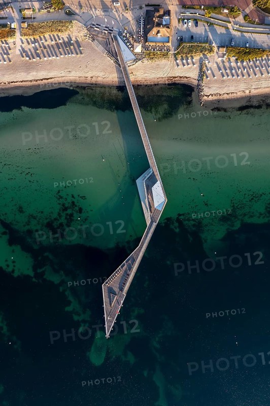 Aerial view over Seebrücke, pier and sandy beach at seaside resort Haffkrug along the Baltic Sea, Scharbeutz, Schleswig-Holstein, Germany