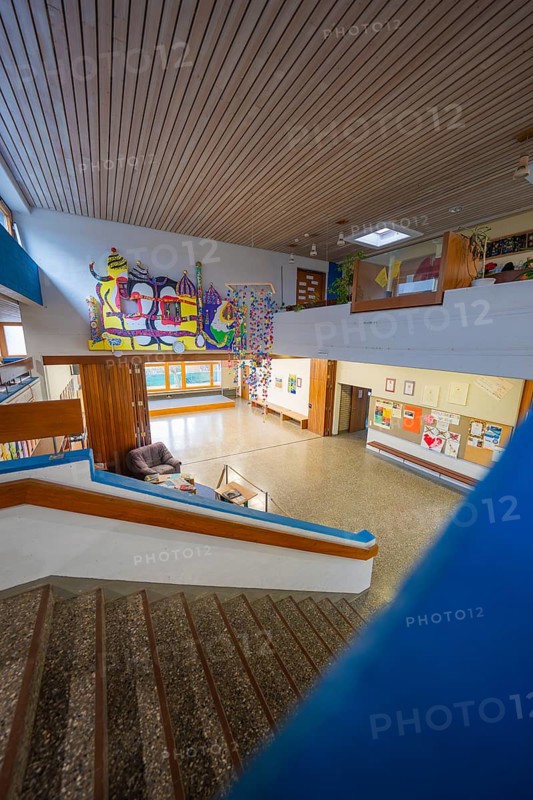 A modern staircase with colorful works of art and plenty of natural light, Schlehengäu Grund Schule Gechingen, Calw District, Germany