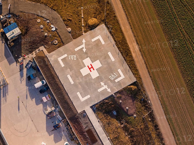 Concrete close-up of a helicopter landing pad with labels and adjacent fields, new hospital at the Calw health campus, Calw district, Germany