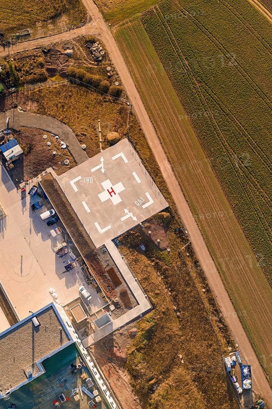 Aerial view of a helipad next to a path and agricultural fields, new hospital at Calw Health Campus, Calw district, Germany