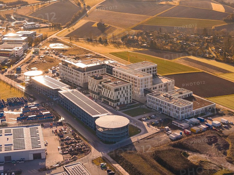 Spacious modern building complexes on the outskirts of a city surrounded by fields, new hospital on the Calw health campus, Calw district, Germany