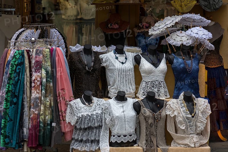 Offers of lace embroidery in a shop window, Burano, Veneto, Italy