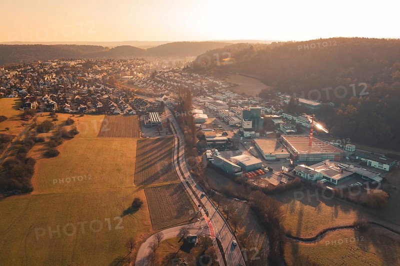 Aerial view of urban and industrial areas transitioning into countryside, Aidlingen, Böblingen District, Germany