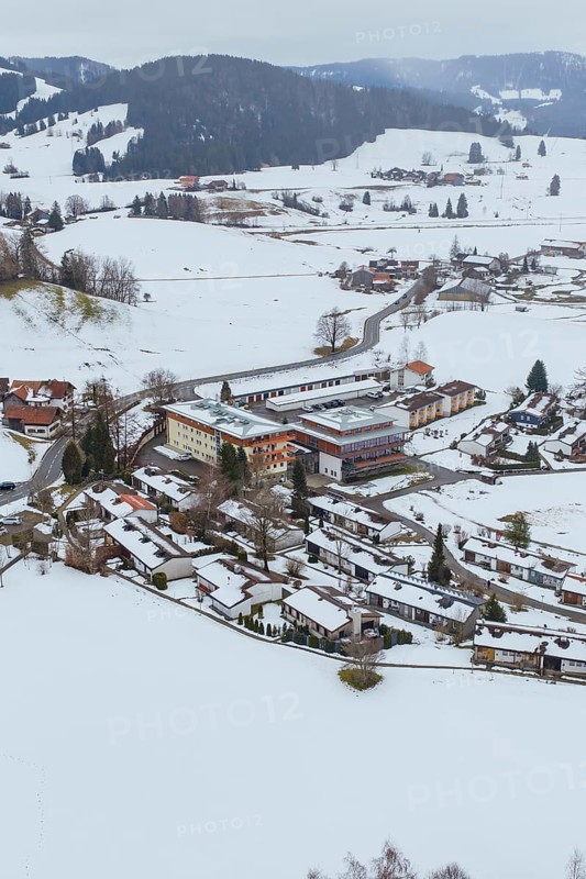 A small village in a snowy landscape with clearly visible roads and buildings, specialist clinic for psychosomatics and psychotherapy, Hochgrat Clinic, Stiefenhofen, Bavaria, Germany
