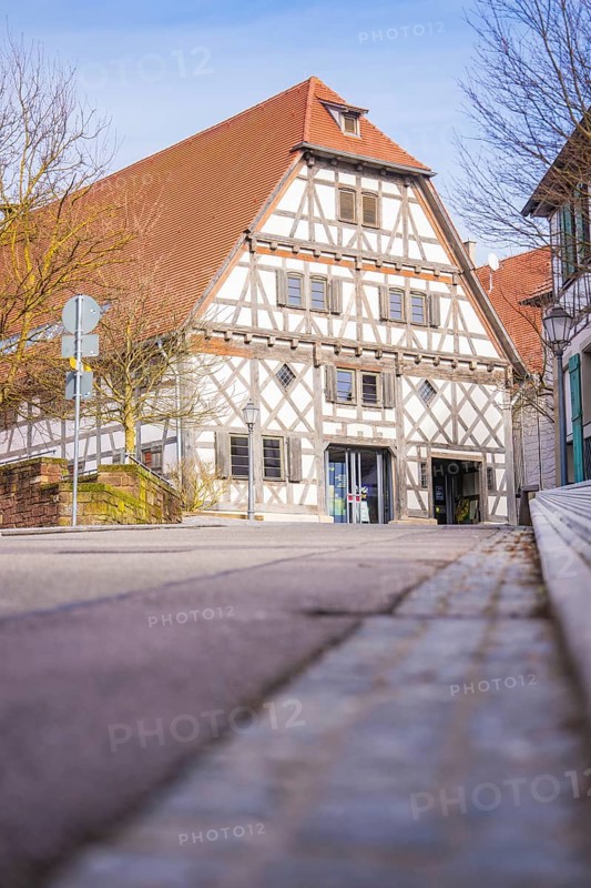 Historic half-timbered house on a quiet street in sunny spring weather, Ötisheim, Enzkreis, Germany