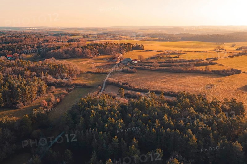 Open landscape with fields and forests at sunset, isolated houses bring seclusion, Gechingen, Calw district, Germany