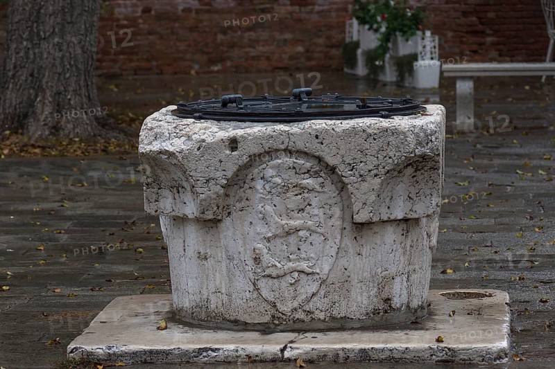 Historic marble fountain with coat of arms, Venice, Veneto, Italy