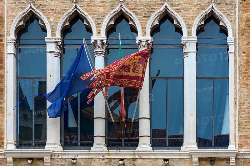 Waving flags of Europe and the Republic of Venice at Palazzo Zaguri, Venice, Venice, Italy