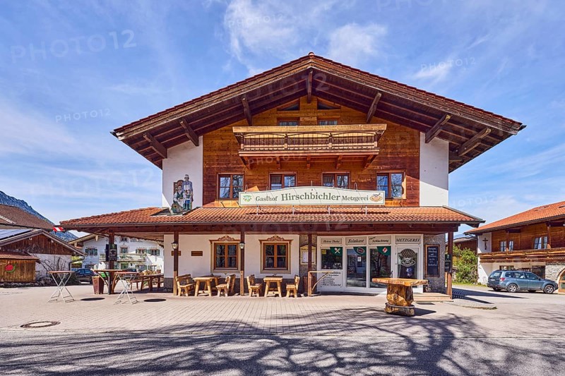 Gasthof und Metzgerei Hirschbichler, commercial building, alpine buildings, building material wood, outdoor area of a restaurant, shade of a tree, milky blue sky, cirrostratus clouds, cirrus clouds, Traunsteiner Straße, Inzell, Traunstein district, Bavaria, Germany