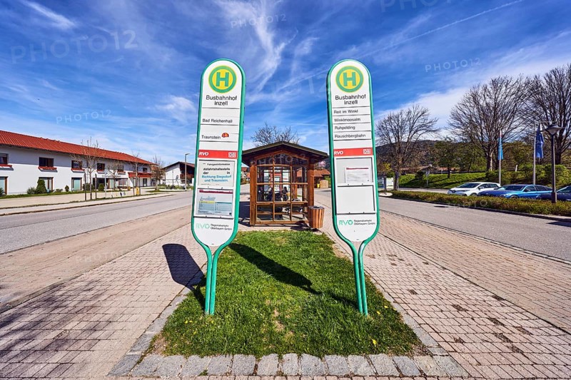 Inzell bus station, Regionalverkehr Oberbayern GmbH, bus stop sign, bus platform, parking lot with cars, general architecture, residential buildings, bare winter trees, hilly landscape, coniferous forest, blue sky, cirrus clouds, cirrostratus clouds, Traunsteiner Straße, Inzell, district of Traunstein, Bavaria, Germany